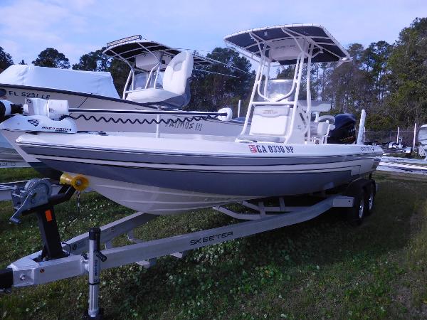 Slide: The Image of 2015 Skeeter SX 240 boat on trailer in outdoor storage area. - 1