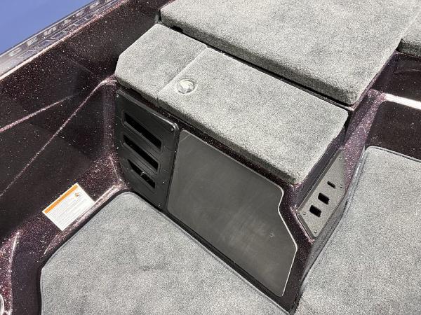 Slide: The Image of 2024 Skeeter ZX150 boat interior with carpeted storage compartments. - 15