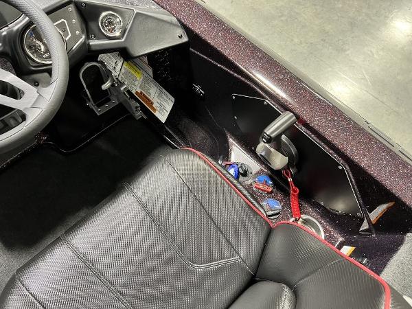 Slide: The Image of 2024 Skeeter ZX150 boat cockpit with steering wheel and control panel. - 19