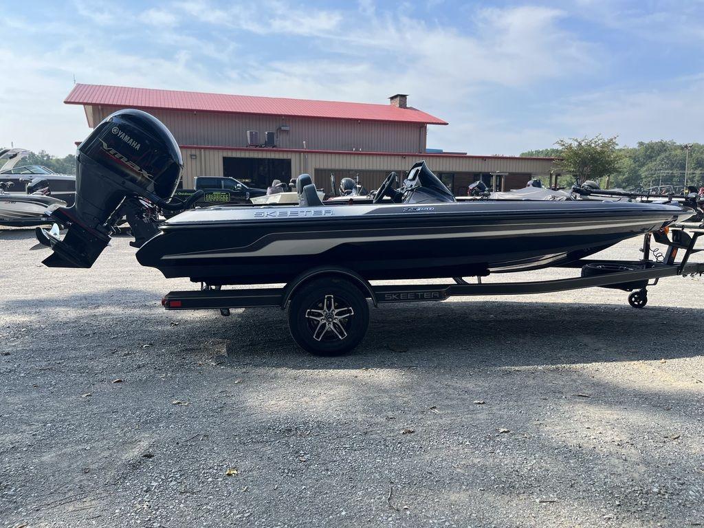 Slide: The Image of 2024 Skeeter ZX150 boat with Yamaha outboard motor on a trailer. - 2