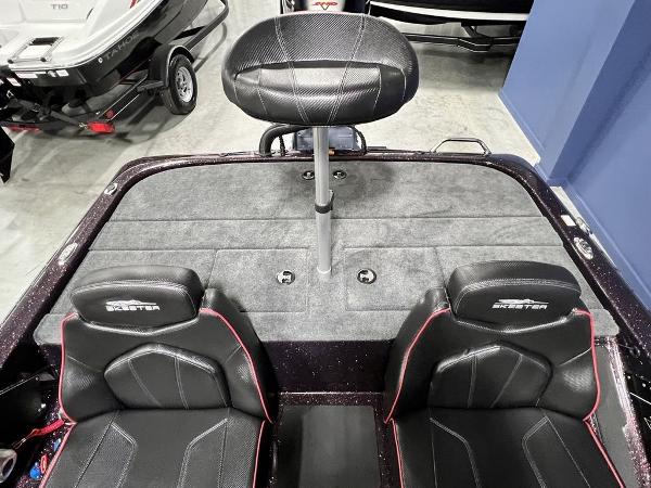 Slide: The Image of 2024 Skeeter ZX150 boat interior with black seats and elevated fishing chair. - 20