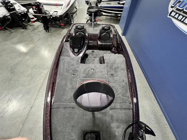 Slide: The Image of 2024 Skeeter ZX150 bass boat interior with seating and storage compartments. - 27