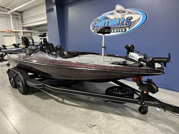 Slide: The Image of 2024 Skeeter ZX150 bass boat on trailer at dealership. - 5