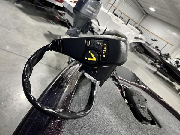 Slide: The Image of 2024 Skeeter ZX150 boat with Fortrex trolling motor in a showroom. - 7