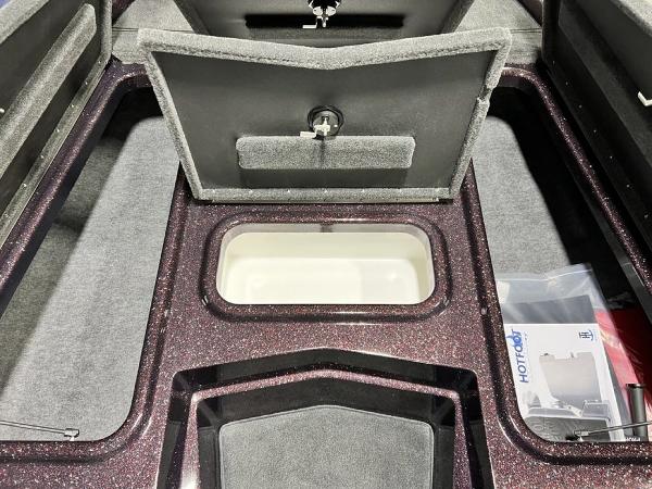Slide: The Image of 2024 Skeeter ZX150 boat storage compartments and livewell. - 9
