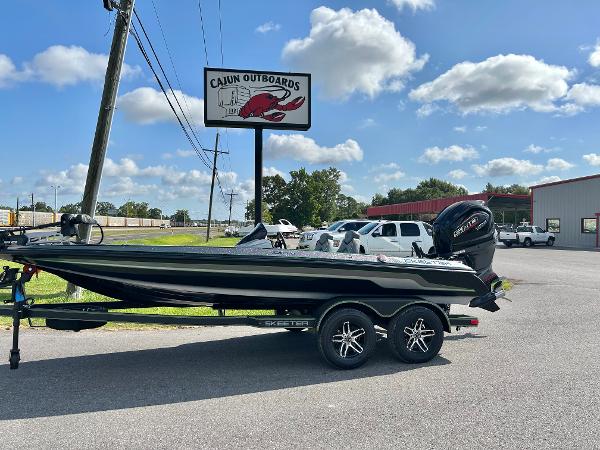 Slide: The Image of 2024 Skeeter ZX 200 boat at Cajun Outboards dealership. - 1