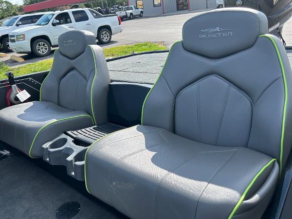 Slide: The Image of 2024 Skeeter ZX 200 boat seats with gray upholstery and green accents. - 3