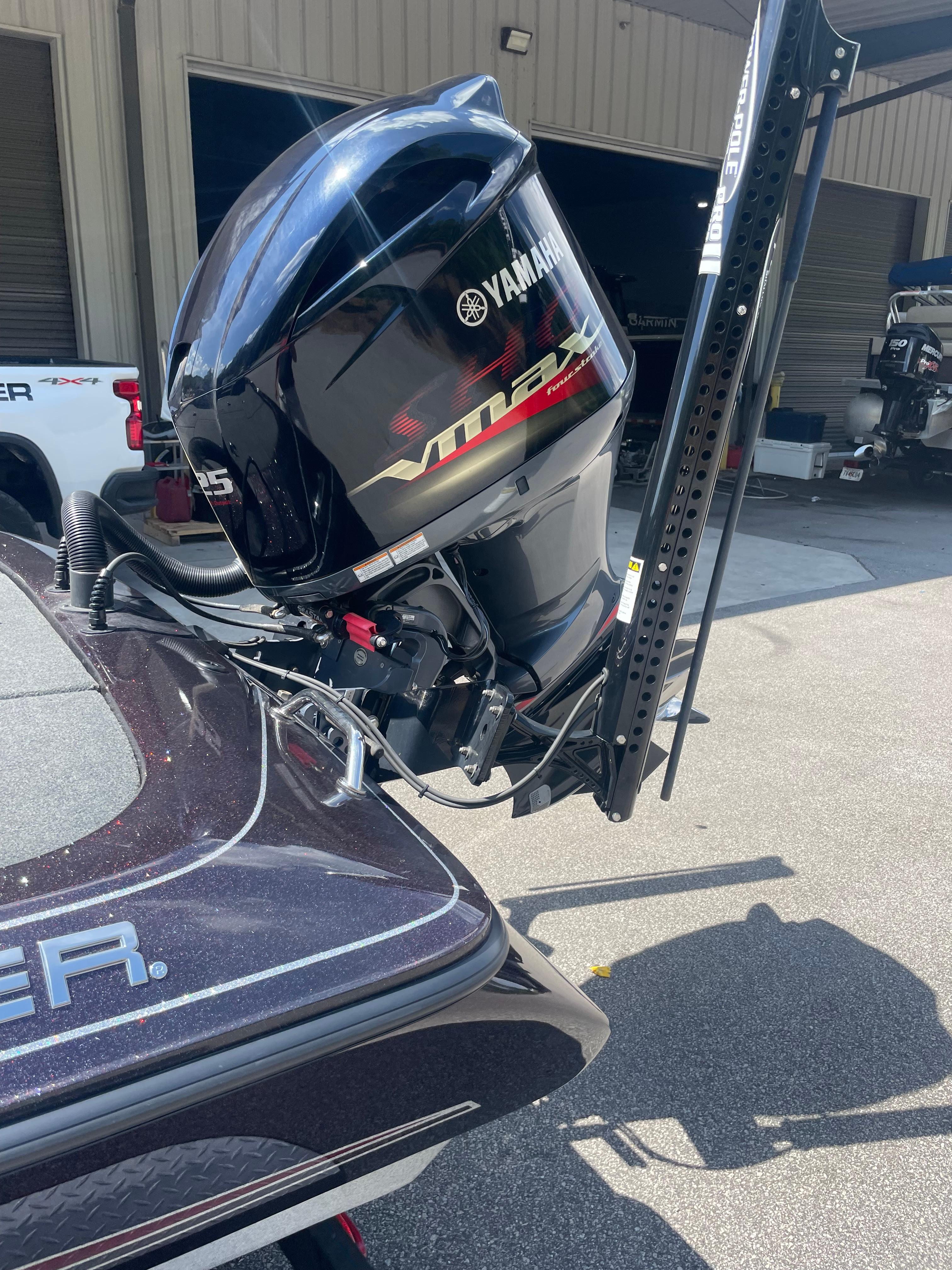Slide: The Image of 2020 Skeeter ZX 225 boat with Yamaha VMAX outboard motor in a garage setting. - 3