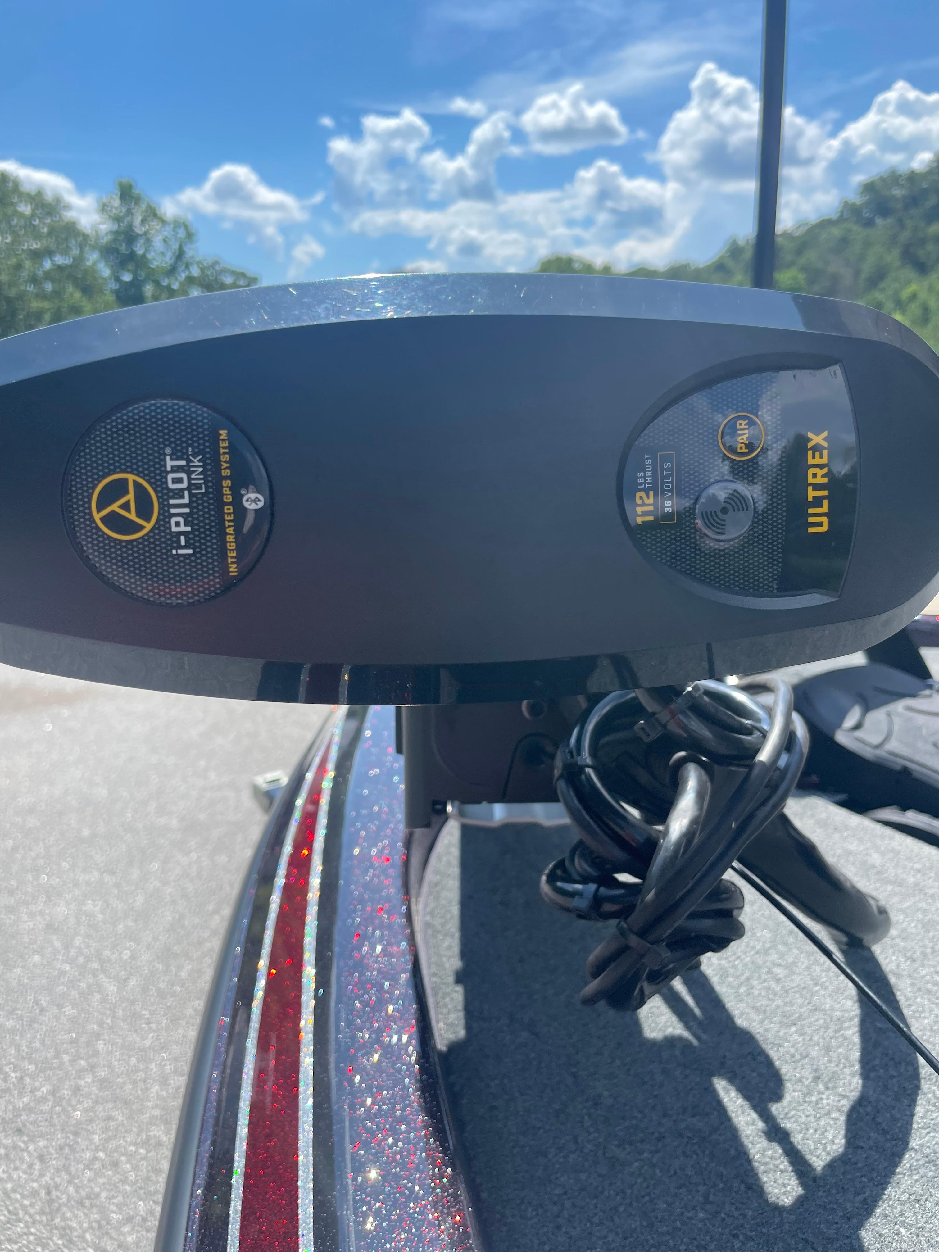 Slide: The Image of 2020 Skeeter ZX 225 boat with i-Pilot Ultrex trolling motor under a clear blue sky. - 7