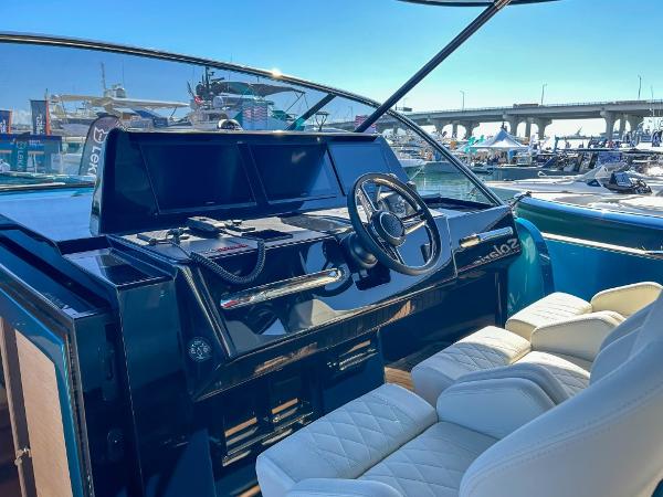Slide: The Image of Helm of 2024 Solaris Power 52 Open yacht with luxurious seating and modern controls. - 11