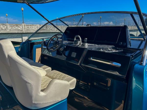 Slide: The Image of 2024 Solaris Power 52 Open yacht helm station with luxurious seating. - 13