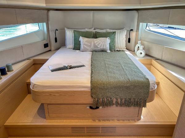 Slide: The Image of Luxurious bedroom interior of 2024 Solaris Power 52 Open yacht with large bed and windows. - 14