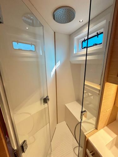 Slide: The Image of 2024 Solaris Power 52 Open yacht bathroom with modern shower and sleek design. - 18