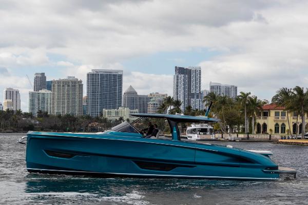 Slide: The Image of 2024 Solaris Power 52 Open yacht cruising near city skyline. - 2