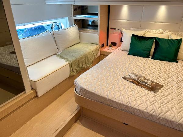 Slide: The Image of Luxurious bedroom interior of 2024 Solaris Power 52 Open yacht with cozy seating area. - 20