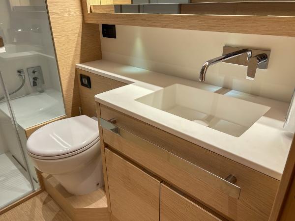 Slide: The Image of Modern bathroom in 2024 Solaris Power 52 Open yacht with sleek fixtures and wooden cabinetry. - 22
