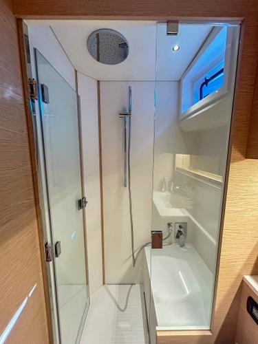 Slide: The Image of Modern bathroom in 2024 Solaris Power 52 Open yacht with glass shower enclosure. - 23