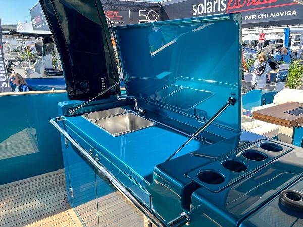 Slide: The Image of 2024 Solaris Power 52 Open yacht with sleek blue outdoor kitchen and sink. - 30