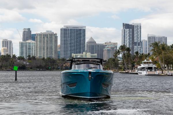Slide: The Image of 2024 Solaris Power 52 Open yacht cruising in urban waterfront. - 4