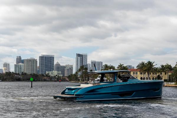 Slide: The Image of 2024 Solaris Power 52 Open yacht cruising near city skyline. - 5