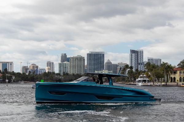 Slide: The Image of 2024 Solaris Power 52 Open yacht cruising with city skyline backdrop. - 6