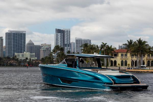Slide: The Image of 2024 Solaris Power 52 Open yacht cruising near city skyline and waterfront homes. - 8
