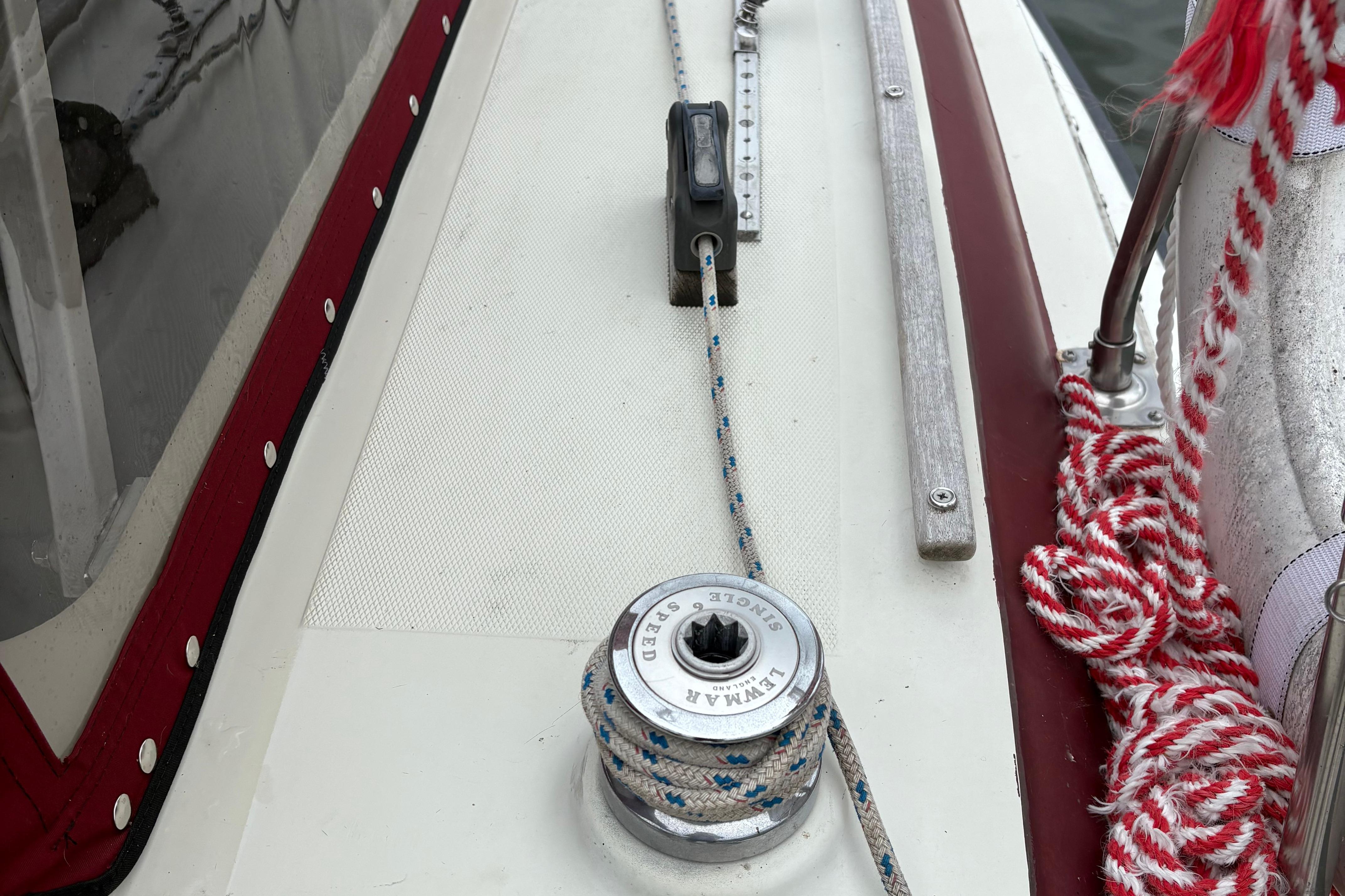 Slide: The Image of Deck of 1983 Sonic 23 sailboat with winch and ropes. - 4