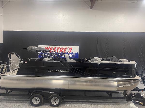 Slide: The Image of 2023 South Bay S224 UL pontoon boat on trailer in showroom. - 3