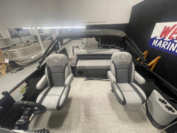 Slide: The Image of 2023 South Bay S224 UL pontoon boat interior with gray seating and modern design. - 7