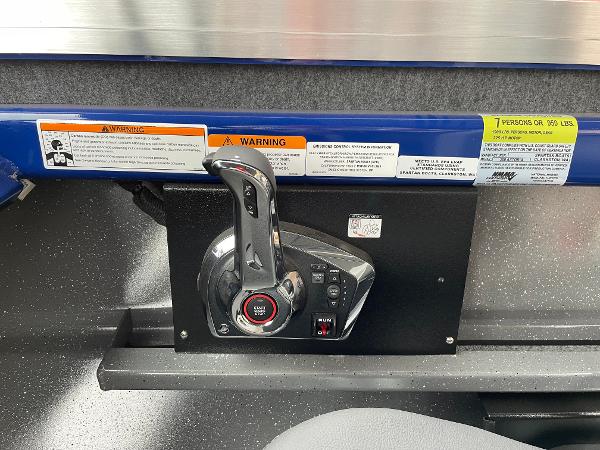 Slide: The Image of Control panel of 2024 Spartan 200 Astoria boat with warning labels. - 12