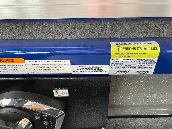 Slide: The Image of 2024 Spartan 200 Astoria boat capacity label, 7 persons or 950 lbs. - 13