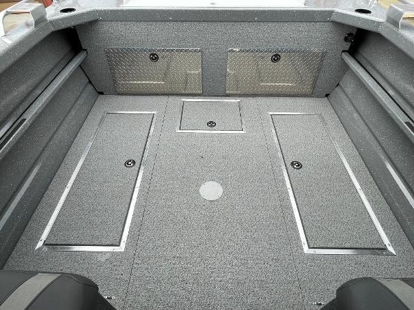 Slide: The Image of 2024 Spartan 200 Astoria boat interior with storage compartments. - 16