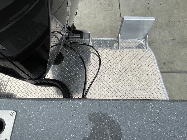 Slide: The Image of 2024 Spartan 200 Astoria boat with diamond plate flooring and motor mount. - 18