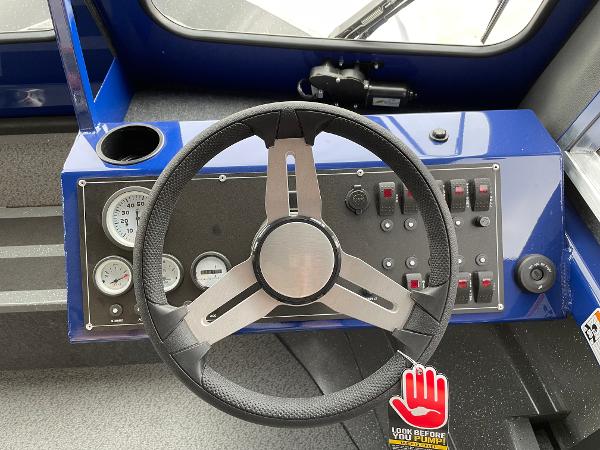 Slide: The Image of Steering wheel and dashboard of 2024 Spartan 200 Astoria boat. - 9