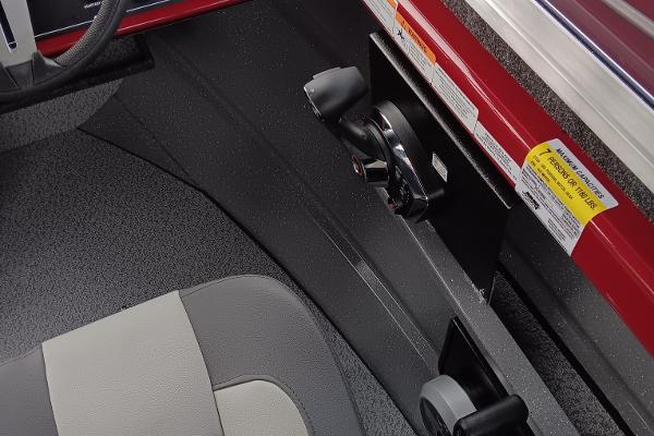 Slide: The Image of 2024 Spartan 215 Athens boat interior with steering and throttle controls. - 4