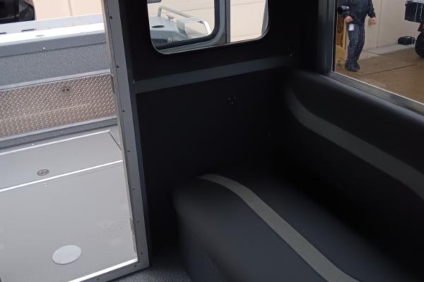 Slide: The Image of Interior of 2024 Spartan 220 Maximus Pro, featuring seating and storage compartments. - 8