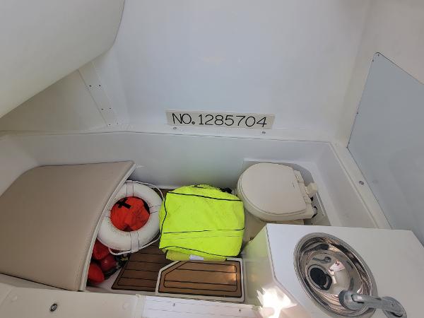 Slide: The Image of 2018 Spectre 35 Center Console by Pilini interior with safety gear and toilet. - 16