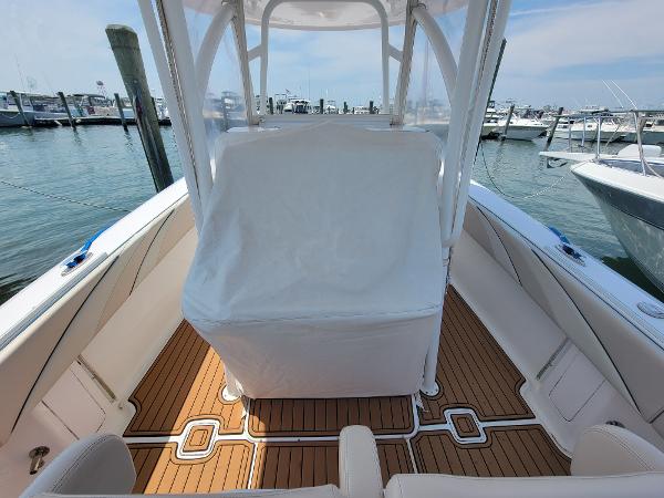 Slide: The Image of 2018 Spectre 35 Center Console by Pilini, teak deck, docked at marina. - 19