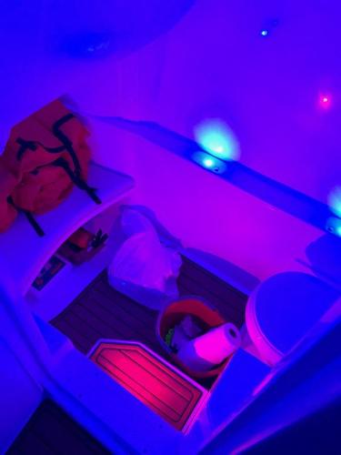 Slide: The Image of 2018 Spectre 35 Center Console by Pilini boat interior with blue LED lighting. - 7