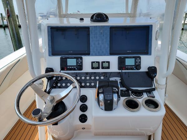 Slide: The Image of 2018 Spectre 35 Center Console by Pilini boat dashboard with dual screens and controls. - 8