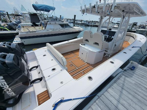 Slide: The Image of 2018 Spectre 35 Center Console by Pilini docked at marina with twin Mercury engines. - 9