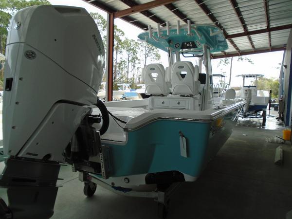 Slide: The Image of 2024 Sportsman 267 boat with outboard motor in covered storage. - 10