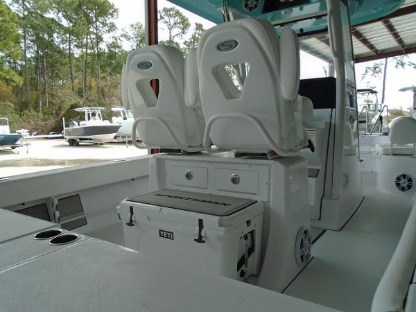 Slide: The Image of 2024 Sportsman 267 boat interior with dual seats and Yeti cooler. - 11