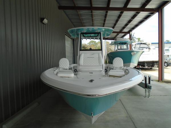 Slide: The Image of 2024 Sportsman 267 boat in a covered storage area. - 2
