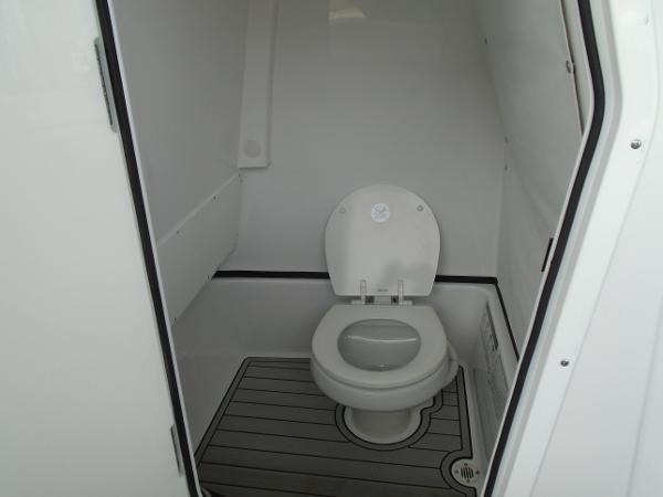 Slide: The Image of 2024 Sportsman 267 boat interior bathroom with toilet. - 3