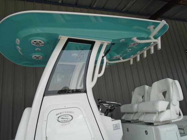 Slide: The Image of 2024 Sportsman 267 boat with teal T-top and white seating. - 5