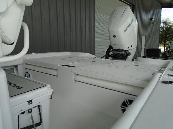 Slide: The Image of 2024 Sportsman 267 boat with Mercury outboard motor in a storage facility. - 6