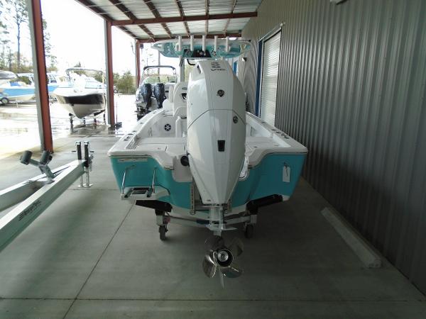 Slide: The Image of 2024 Sportsman 267 boat, rear view, parked in covered storage area. - 7