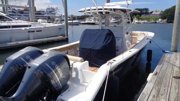Slide: The Image of 2017 Sportsman 312 Open boat docked with twin Yamaha engines. - 0