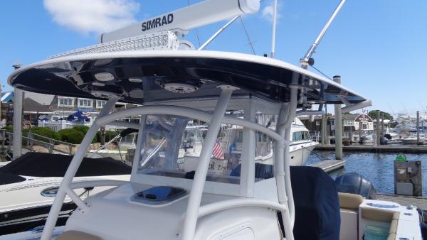 Slide: The Image of 2017 Sportsman 312 Open boat with Simrad radar, docked at a marina. - 3